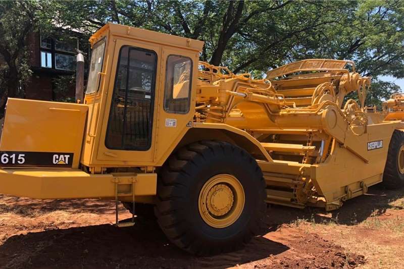  1997 Caterpillar 615 Belly Scraper Damskrop